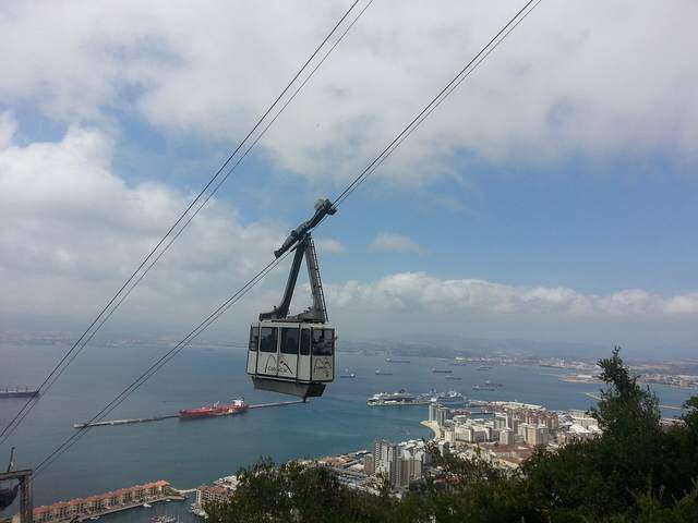 A Gibraltar cable car cabin above the town and Bay