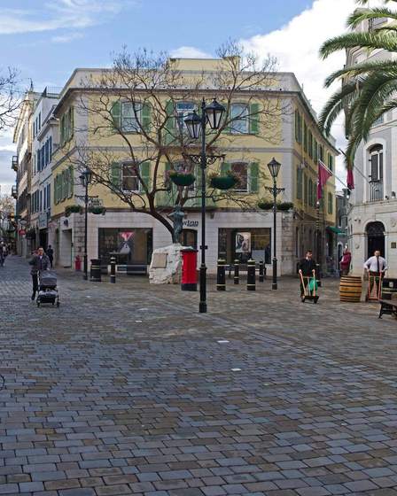 A cobbled square on Main Street with shuttered buildings