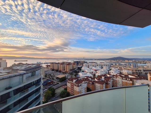 View from the studio's terrace across the Bay of Gibraltar under a sunset sky